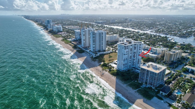 aerial view featuring a water view and a beach view