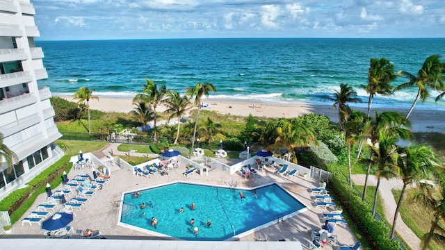 bird's eye view featuring a water view and a view of the beach