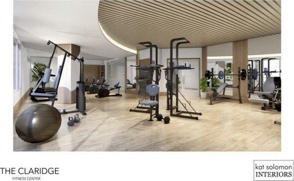 workout area featuring plenty of natural light and wood-type flooring