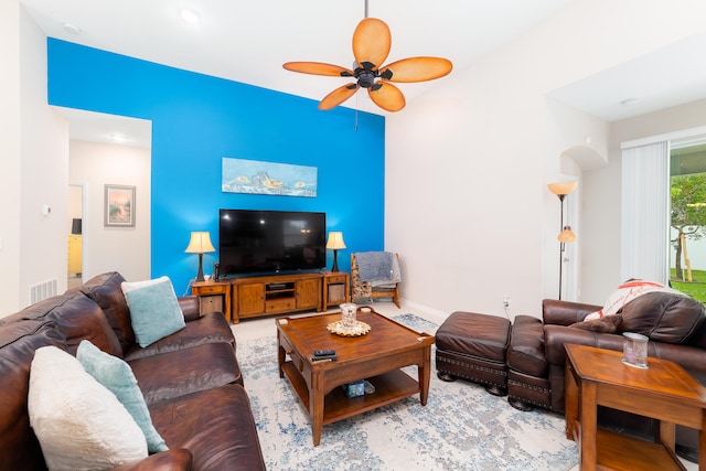 living room featuring light hardwood / wood-style flooring and ceiling fan