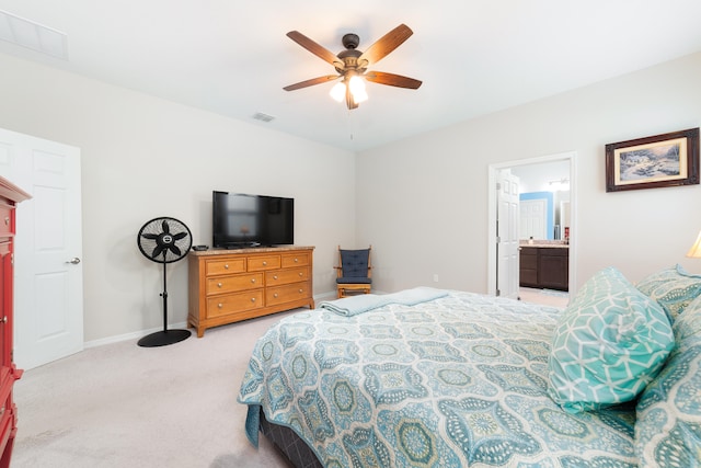 carpeted bedroom featuring ensuite bathroom and ceiling fan