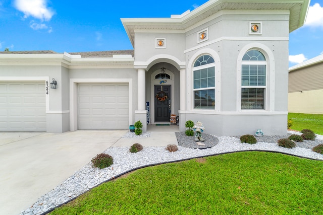 view of front of house with a garage and a front yard