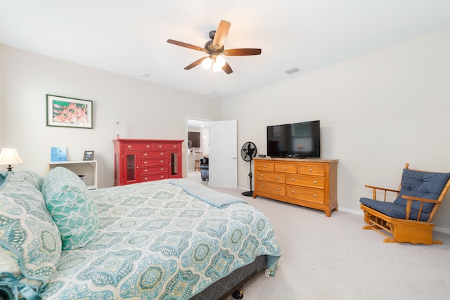 bedroom featuring light colored carpet and ceiling fan