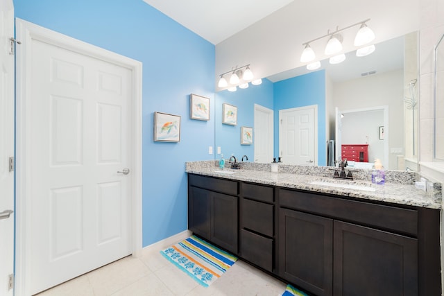 bathroom with vanity and tile patterned flooring