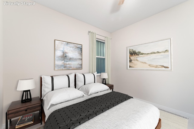 bedroom featuring ceiling fan and carpet flooring