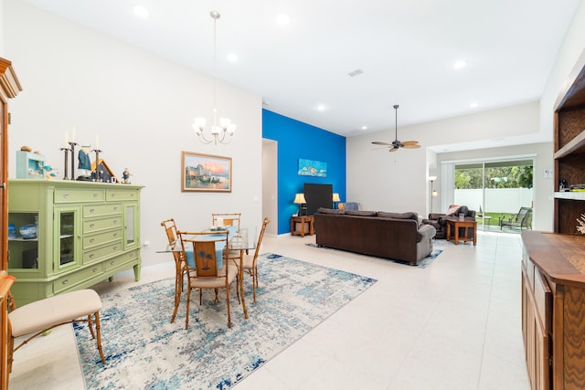 dining room with ceiling fan with notable chandelier