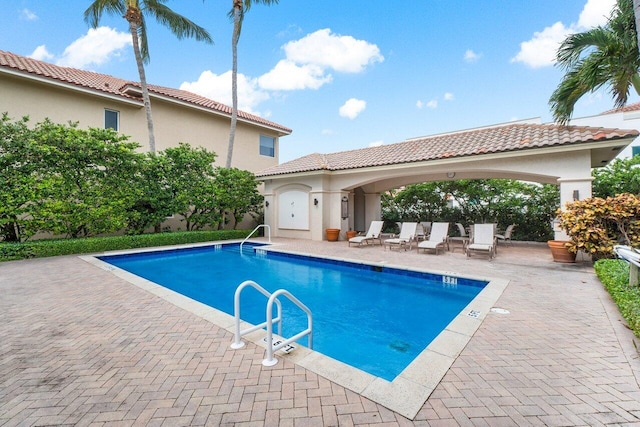 view of pool featuring a patio