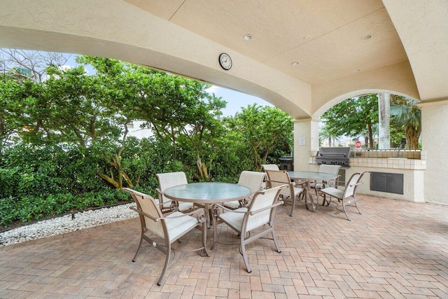 view of patio with area for grilling and exterior kitchen