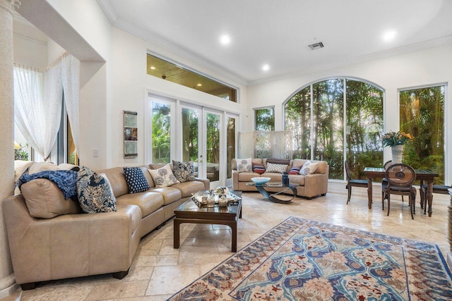 living room featuring french doors and crown molding