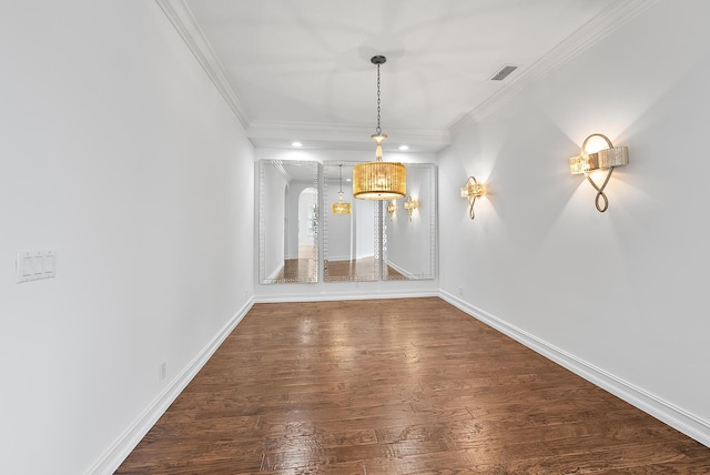 interior space featuring dark hardwood / wood-style flooring, ornamental molding, and a notable chandelier