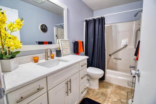 bathroom with tile patterned flooring, vanity, and toilet