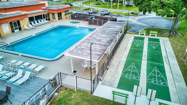 view of swimming pool with a patio