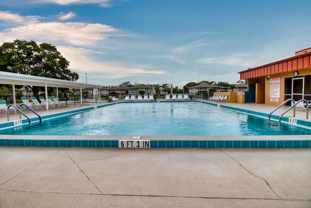 view of swimming pool with a patio