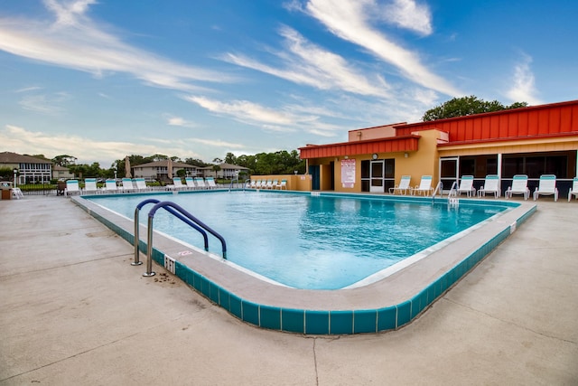 view of swimming pool featuring a patio area