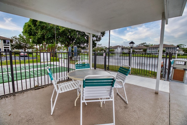 view of patio / terrace with a water view