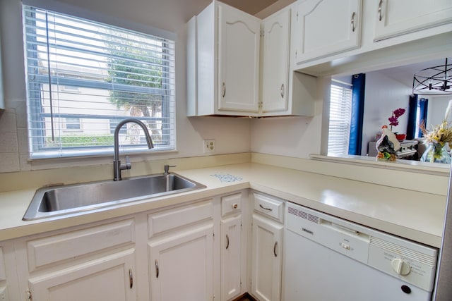 kitchen featuring dishwasher, white cabinetry, a healthy amount of sunlight, and sink