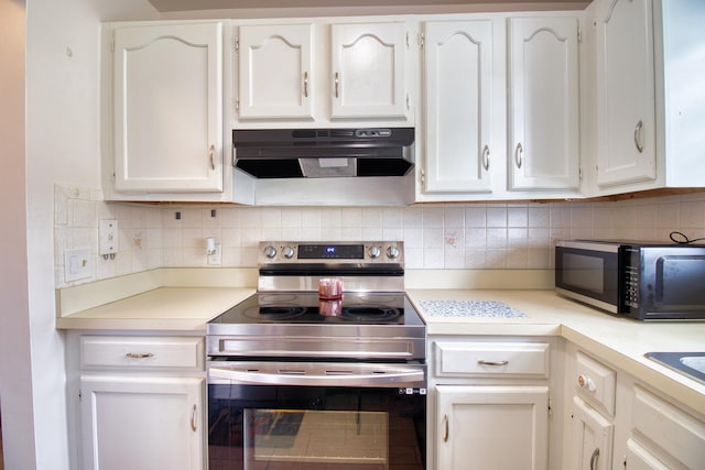 kitchen with backsplash, stainless steel range with electric stovetop, and white cabinets