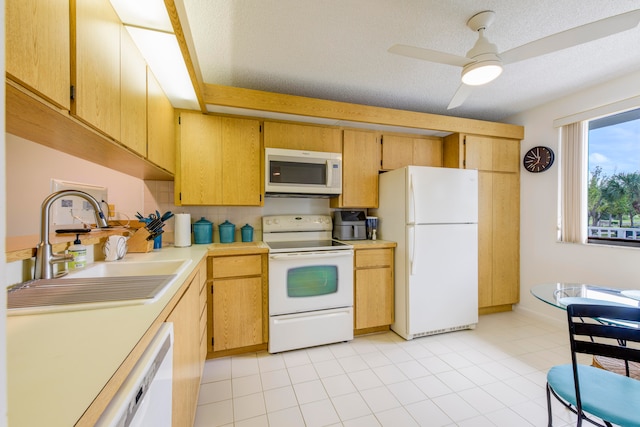 kitchen with sink, tasteful backsplash, white appliances, a textured ceiling, and ceiling fan