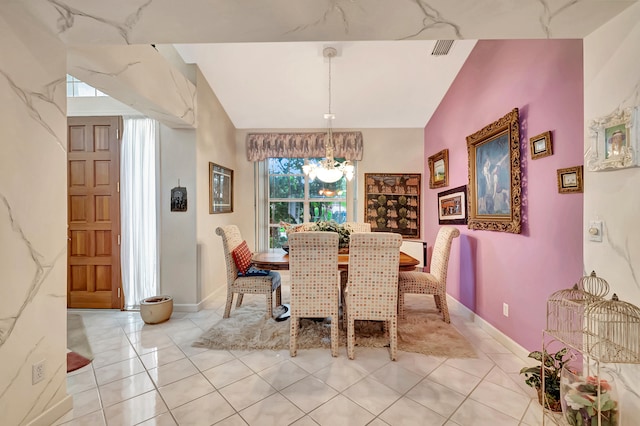 tiled dining area with a notable chandelier