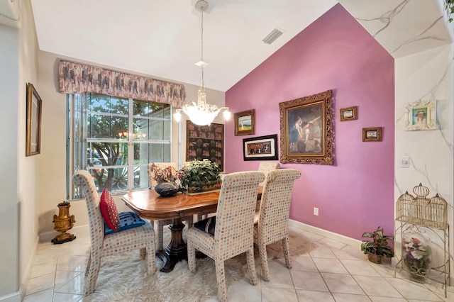 dining space featuring light tile patterned floors, a chandelier, and lofted ceiling