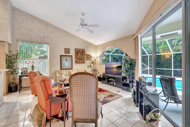 tiled living room with vaulted ceiling and ceiling fan