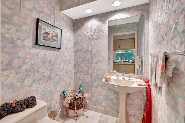 bathroom featuring tile patterned floors and toilet