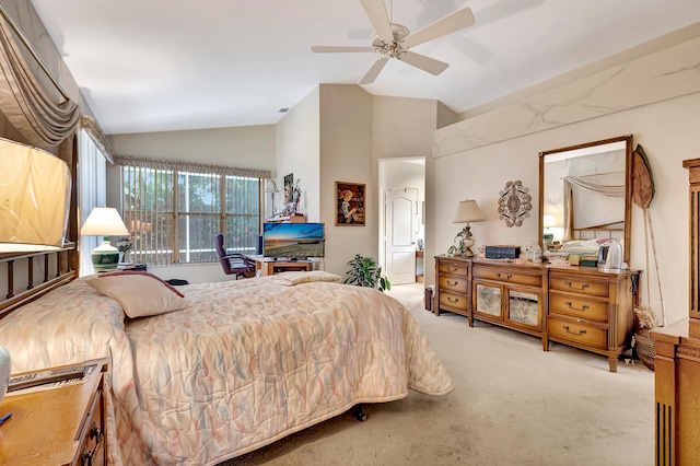 bedroom with ceiling fan, light carpet, and vaulted ceiling