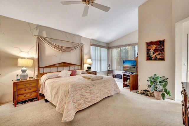 carpeted bedroom with vaulted ceiling and ceiling fan