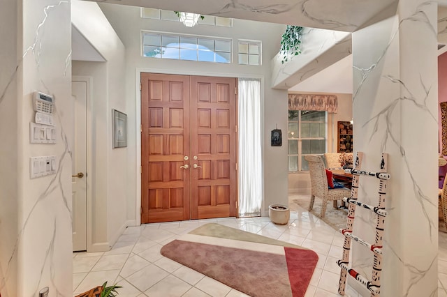 tiled entrance foyer with a wealth of natural light