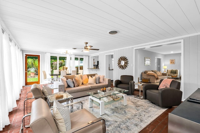 living room featuring ceiling fan, wood ceiling, and ornamental molding