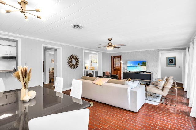 living room with ornamental molding and ceiling fan