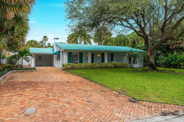 ranch-style home with a front lawn