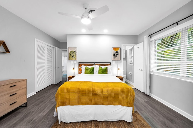 bedroom featuring dark hardwood / wood-style floors, ceiling fan, and a closet