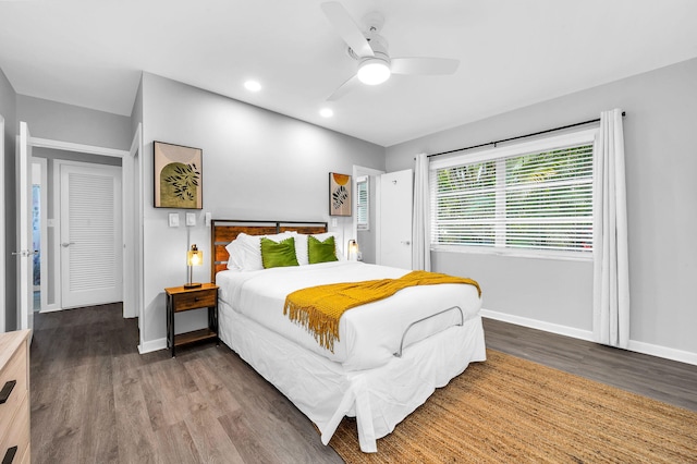 bedroom featuring ceiling fan and dark hardwood / wood-style floors