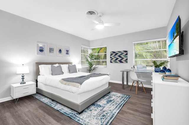 bedroom featuring ceiling fan and dark hardwood / wood-style floors