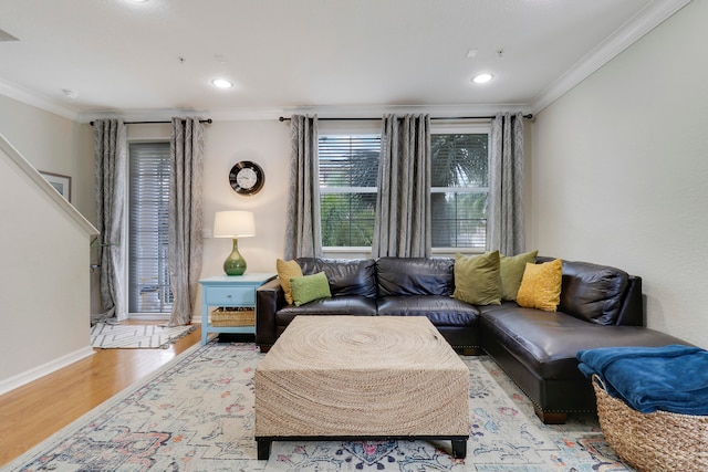 living room with light wood-type flooring and crown molding