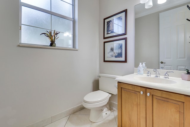 bathroom featuring toilet, vanity, and tile patterned floors