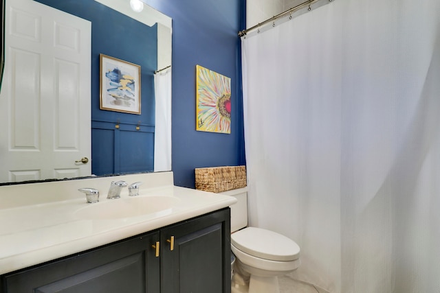 bathroom featuring vanity and toilet