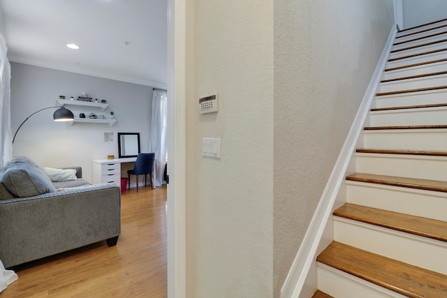 stairs with hardwood / wood-style floors