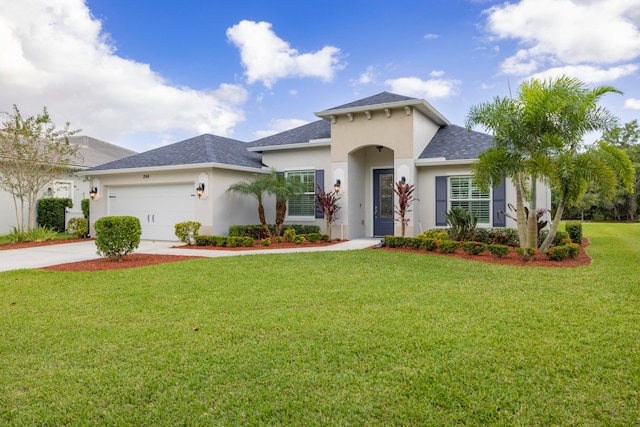 view of front of home with a garage and a front yard