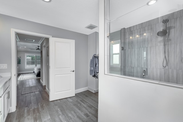 corridor featuring wood-type flooring and a textured ceiling