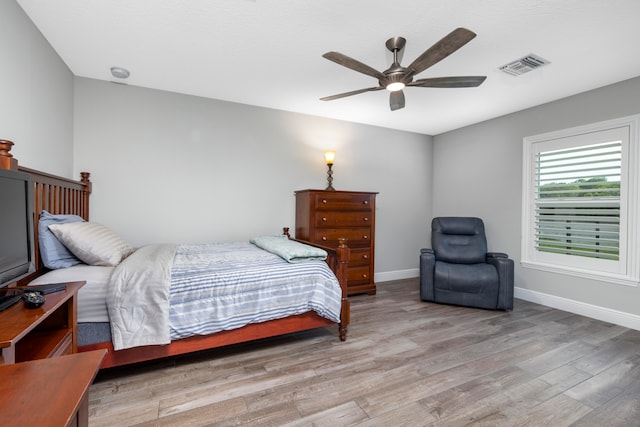 bedroom featuring ceiling fan and light hardwood / wood-style flooring