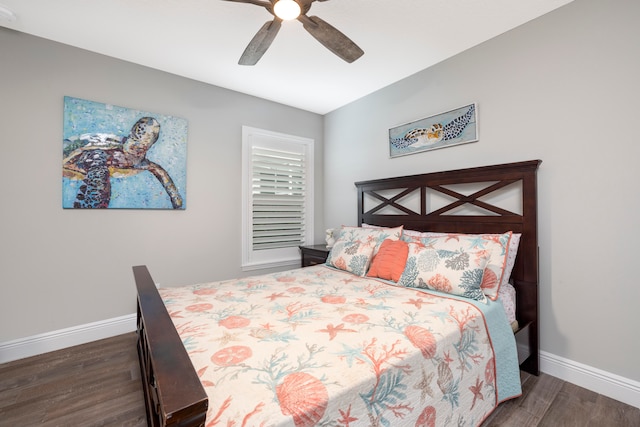 bedroom with ceiling fan and dark hardwood / wood-style floors