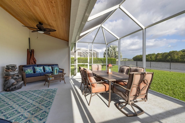 view of patio with a lanai, outdoor lounge area, and ceiling fan