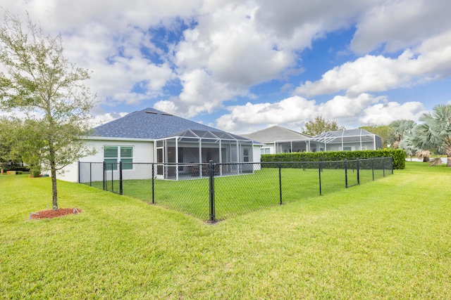 view of yard featuring glass enclosure