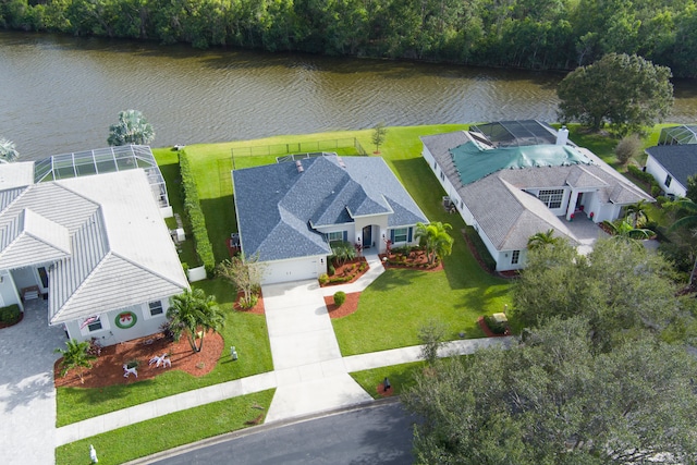 birds eye view of property with a water view