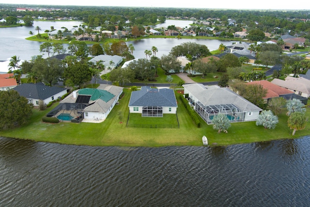 birds eye view of property with a water view