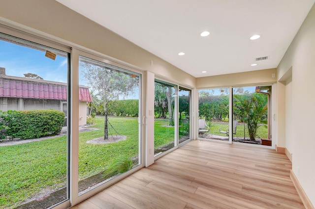 unfurnished sunroom featuring plenty of natural light