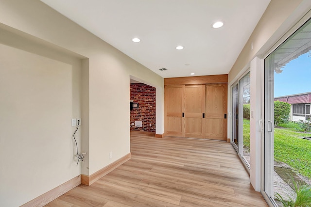 hallway with light wood-type flooring