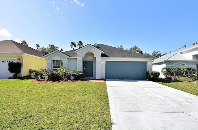 ranch-style home featuring a garage and a front yard